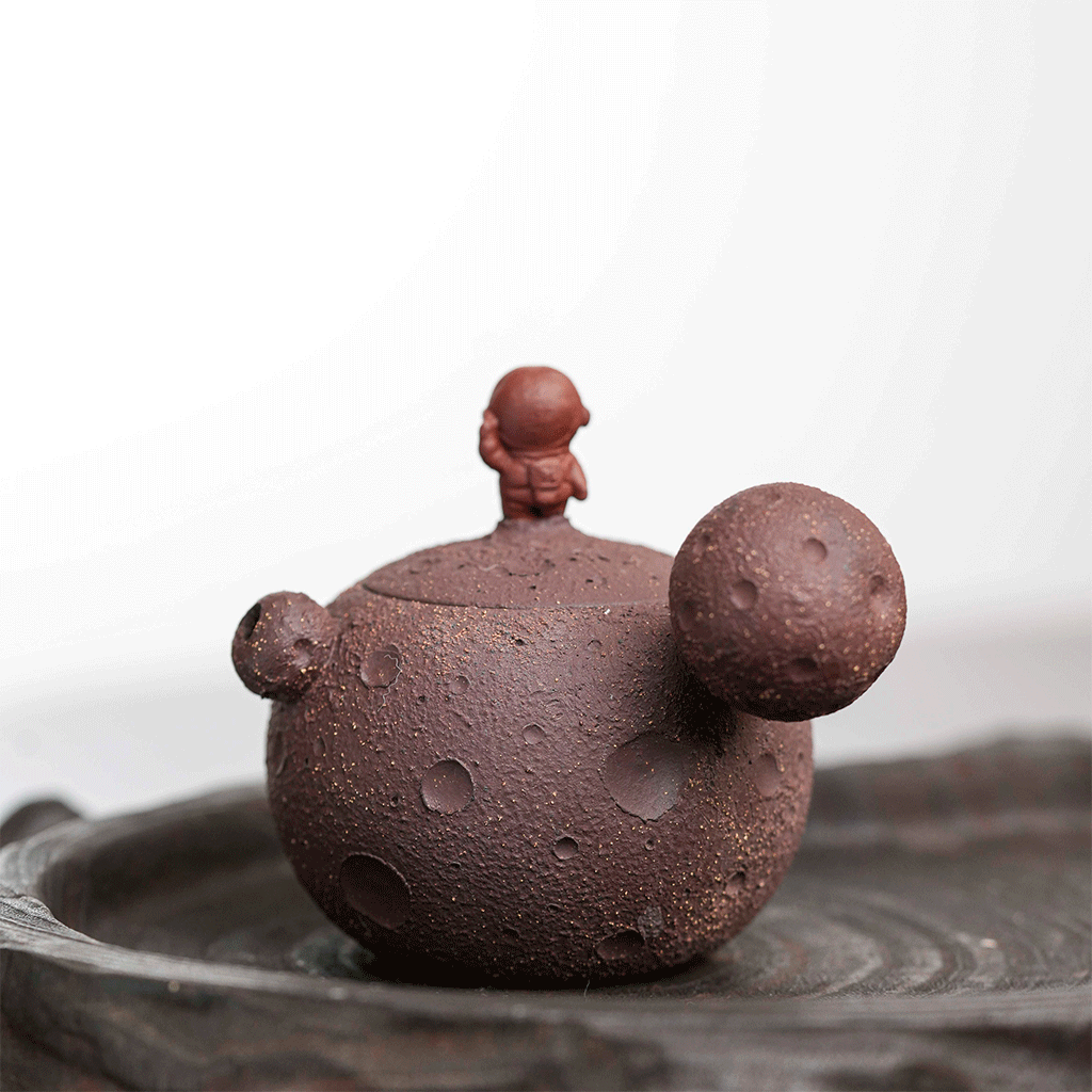 Raw purple clay teapot