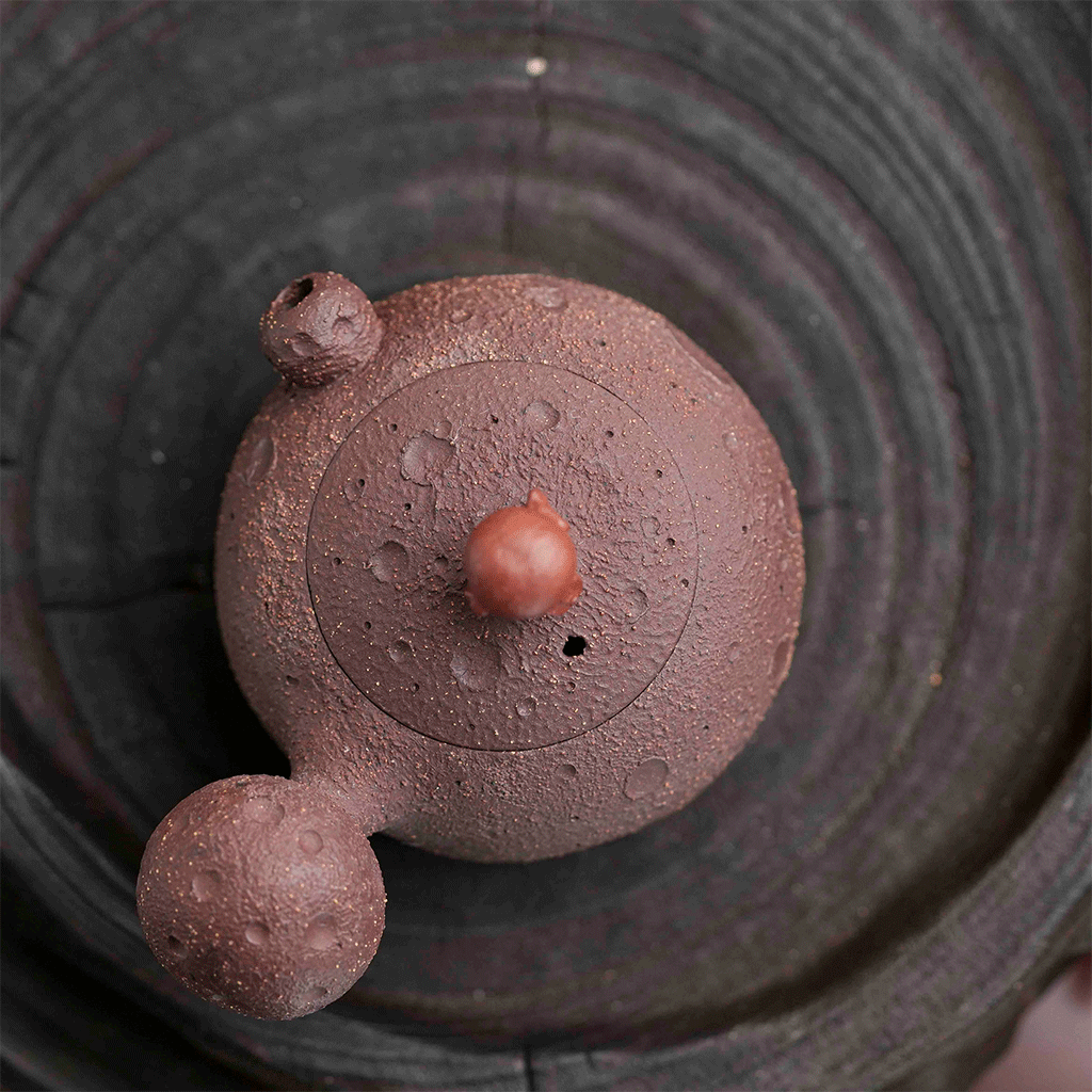 Raw purple clay teapot